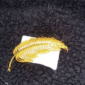 Solid gold tone fern brooch